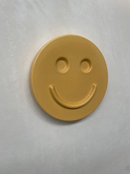 Yellow 'HAPPY' ceramic artwork