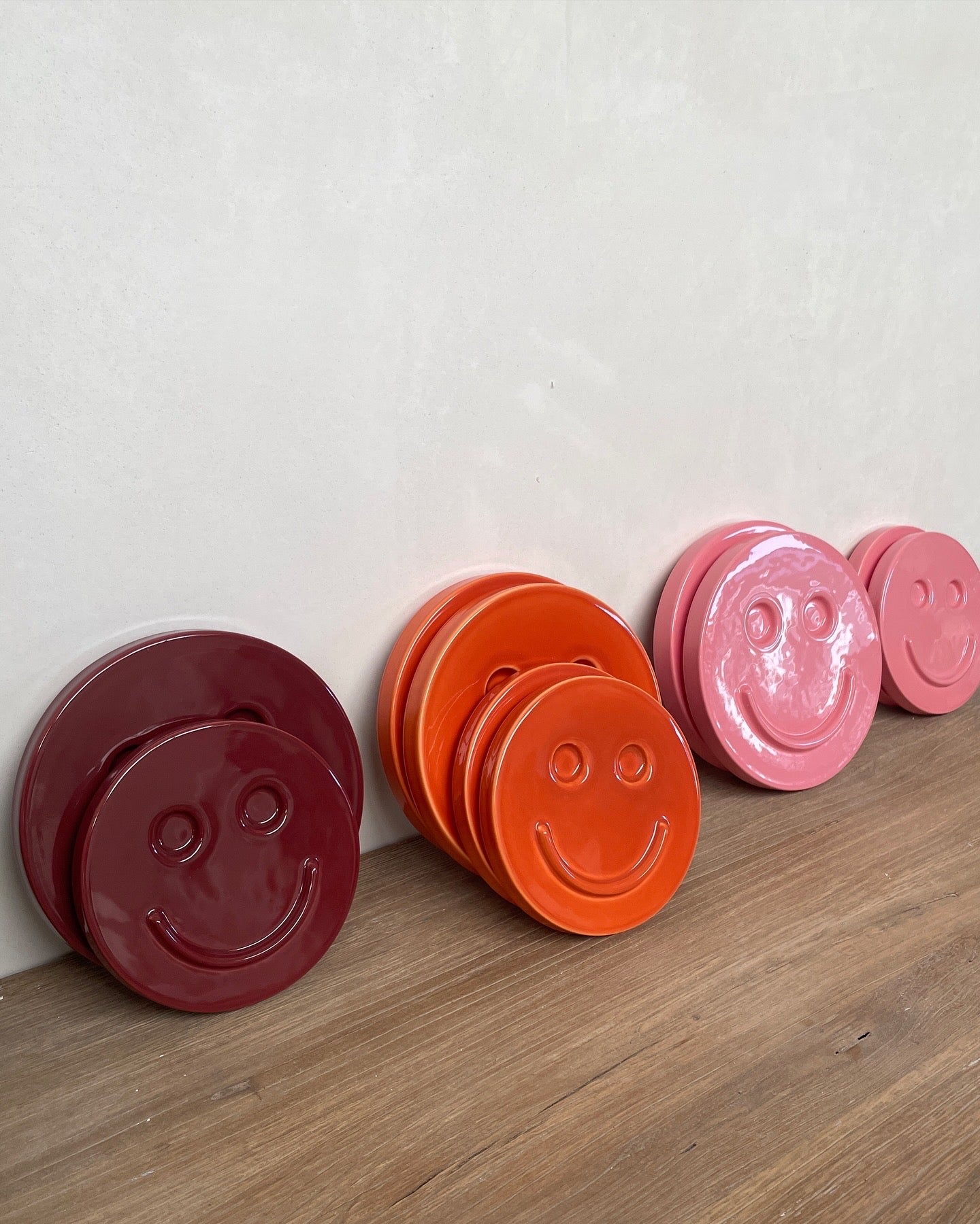 Pink 'HAPPY' ceramic artwork