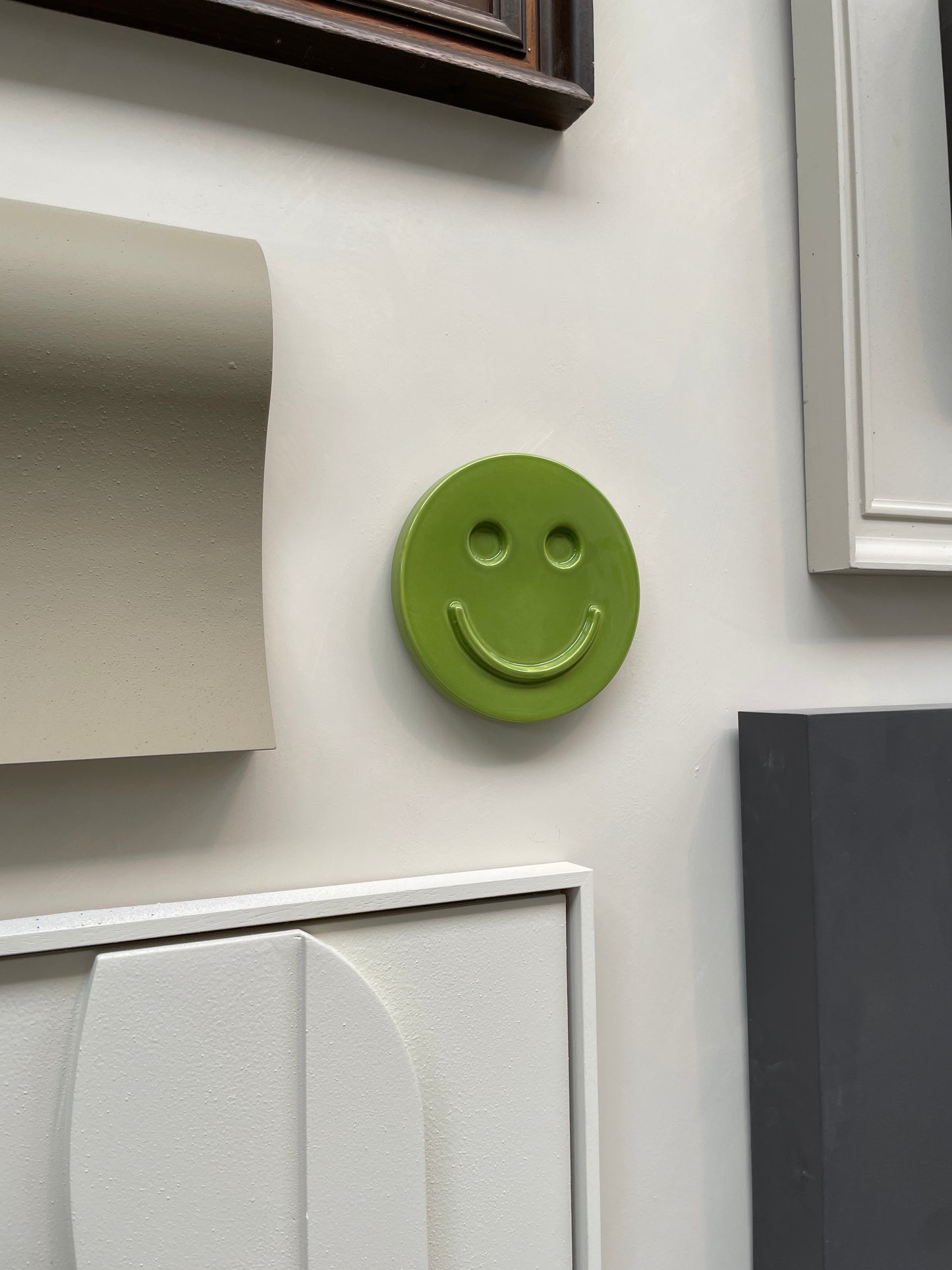 Green 'HAPPY' ceramic artwork