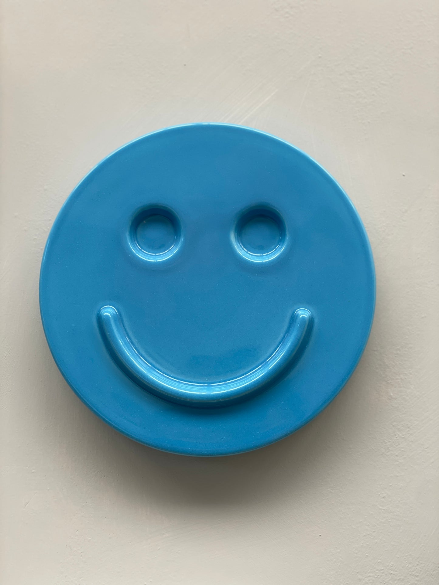 Blue 'HAPPY' ceramic artwork