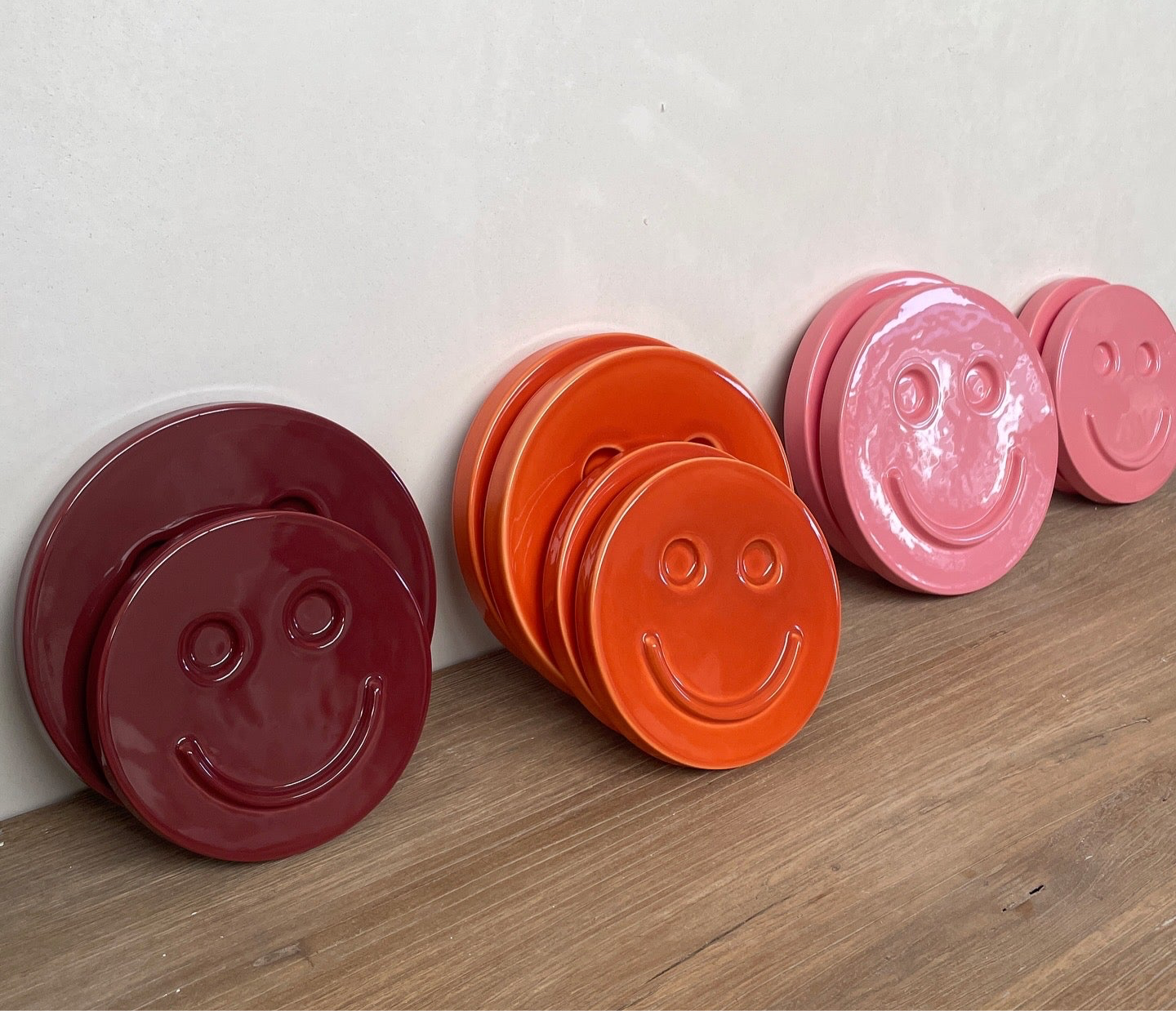 Orange 'HAPPY' ceramic artwork