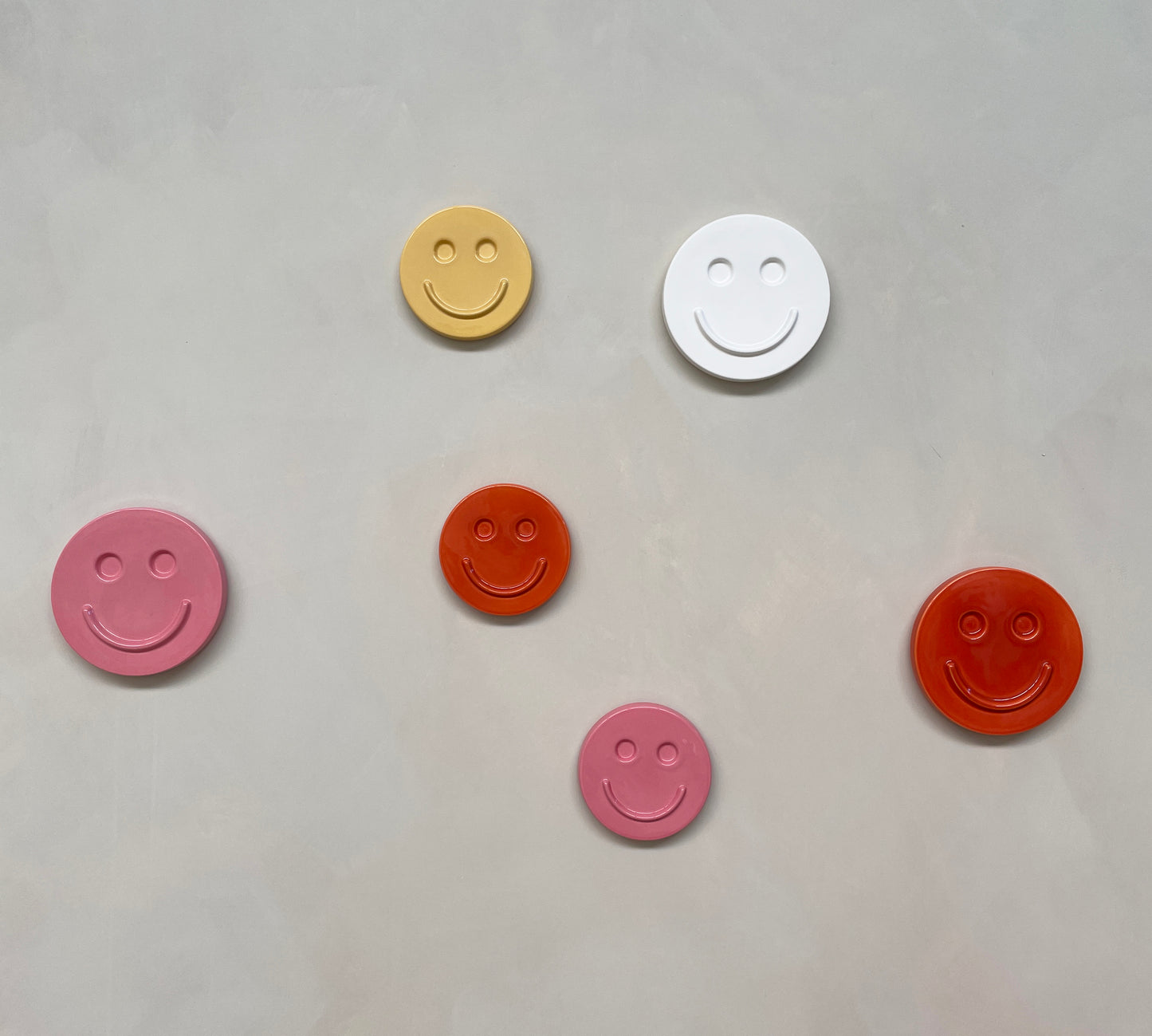 Orange 'HAPPY' ceramic artwork