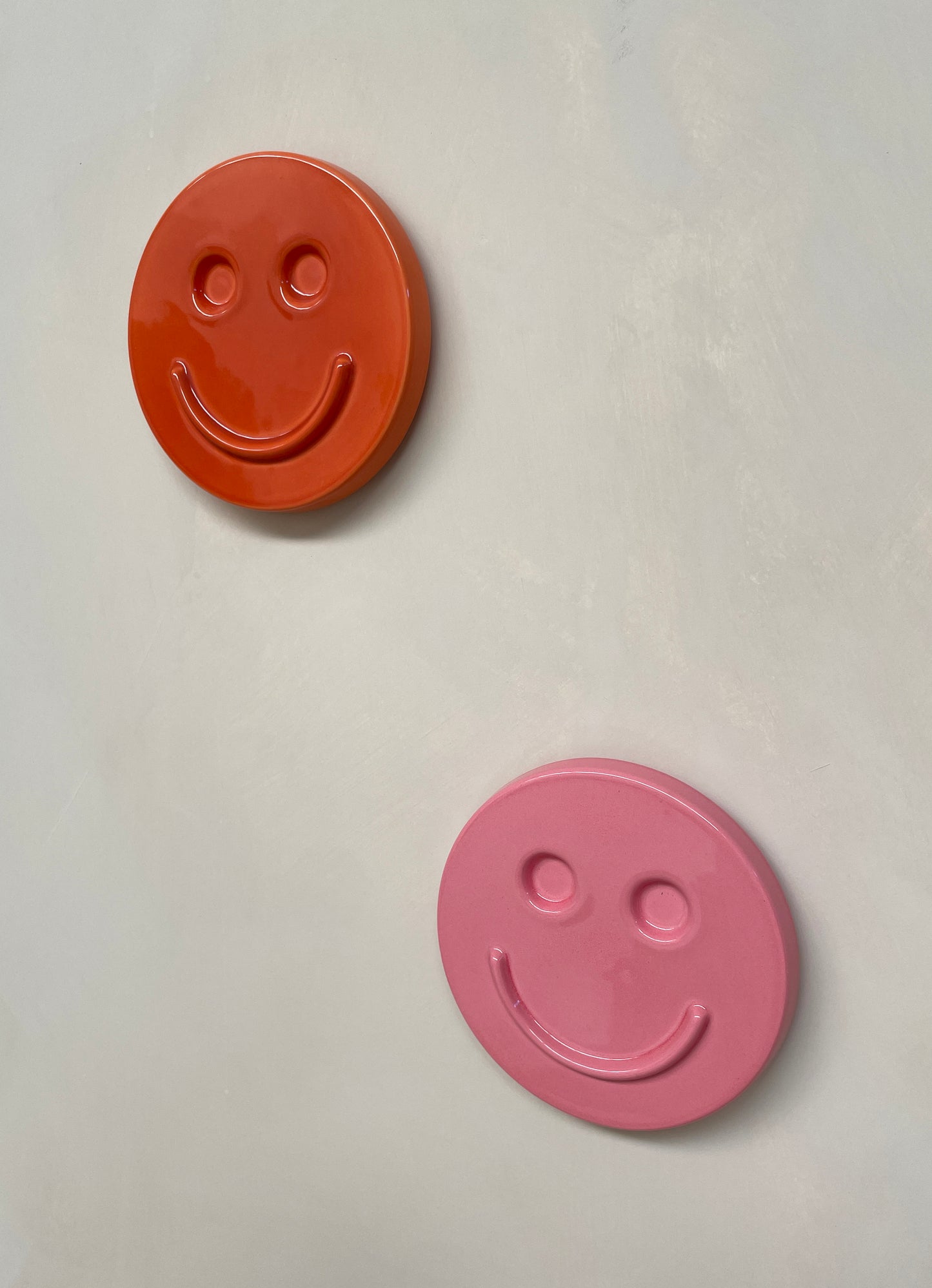 Orange 'HAPPY' ceramic artwork