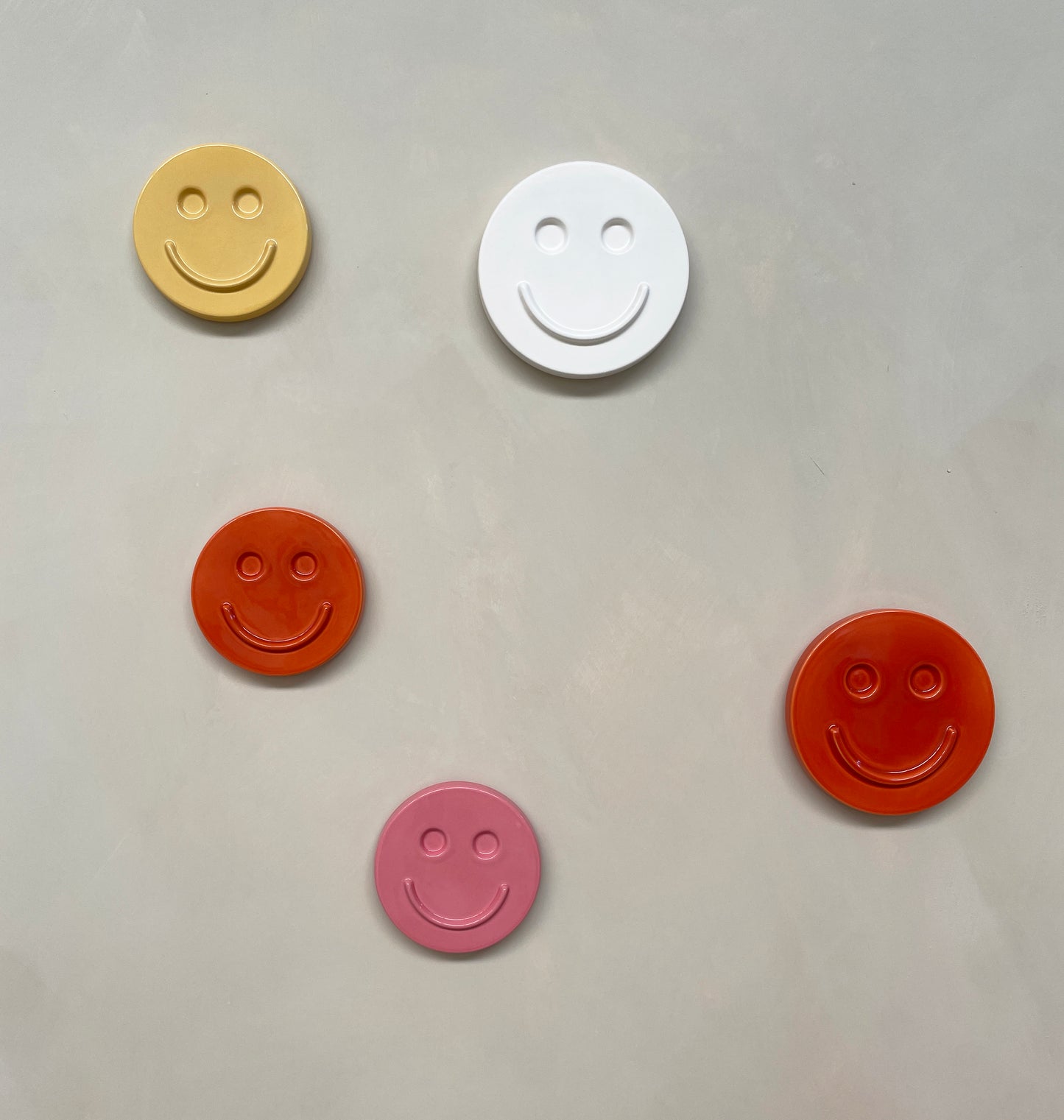 Orange 'HAPPY' ceramic artwork