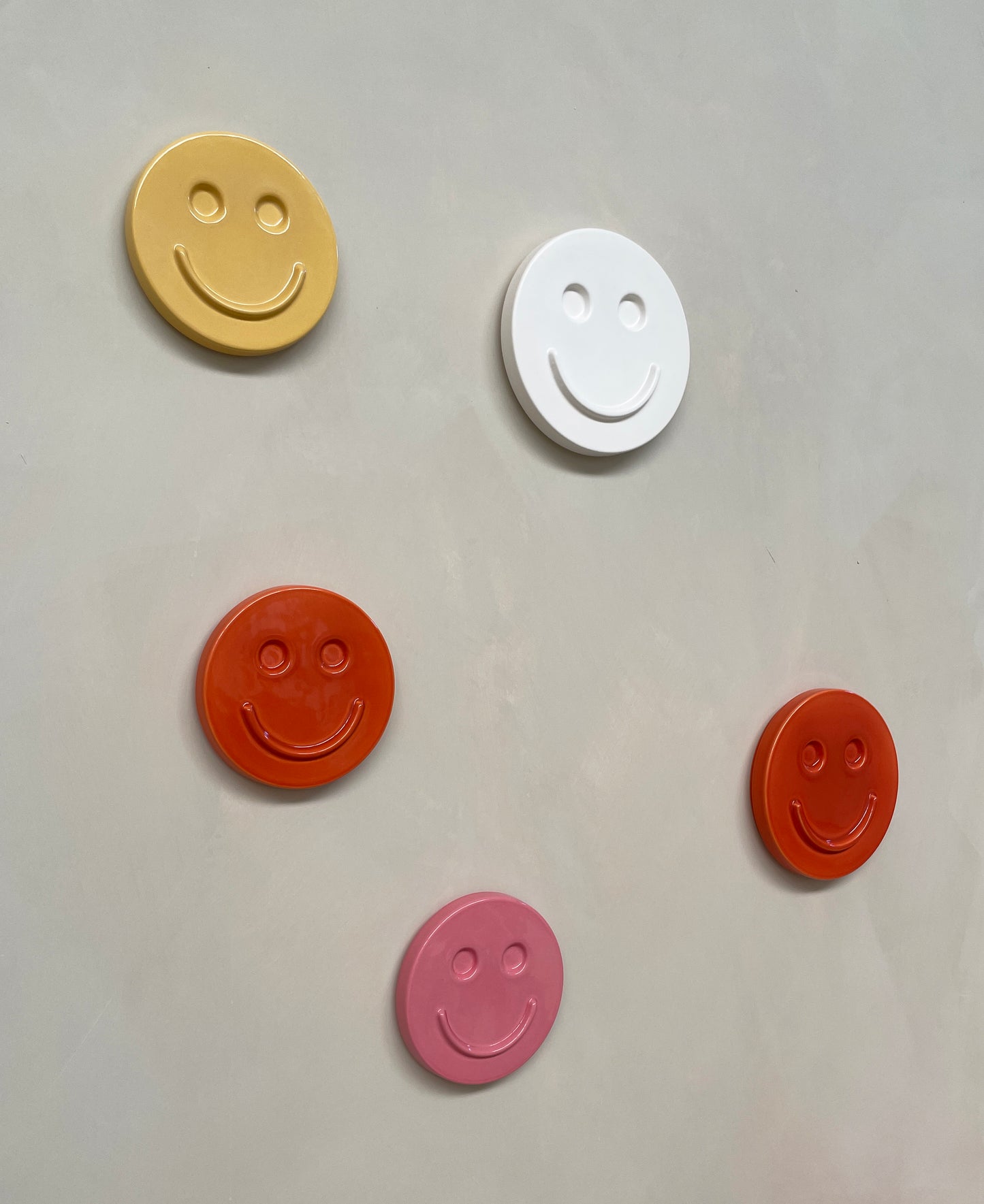 Orange 'HAPPY' ceramic artwork