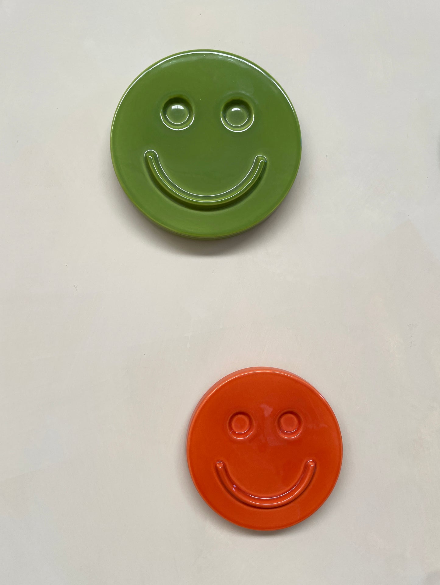 Orange 'HAPPY' ceramic artwork