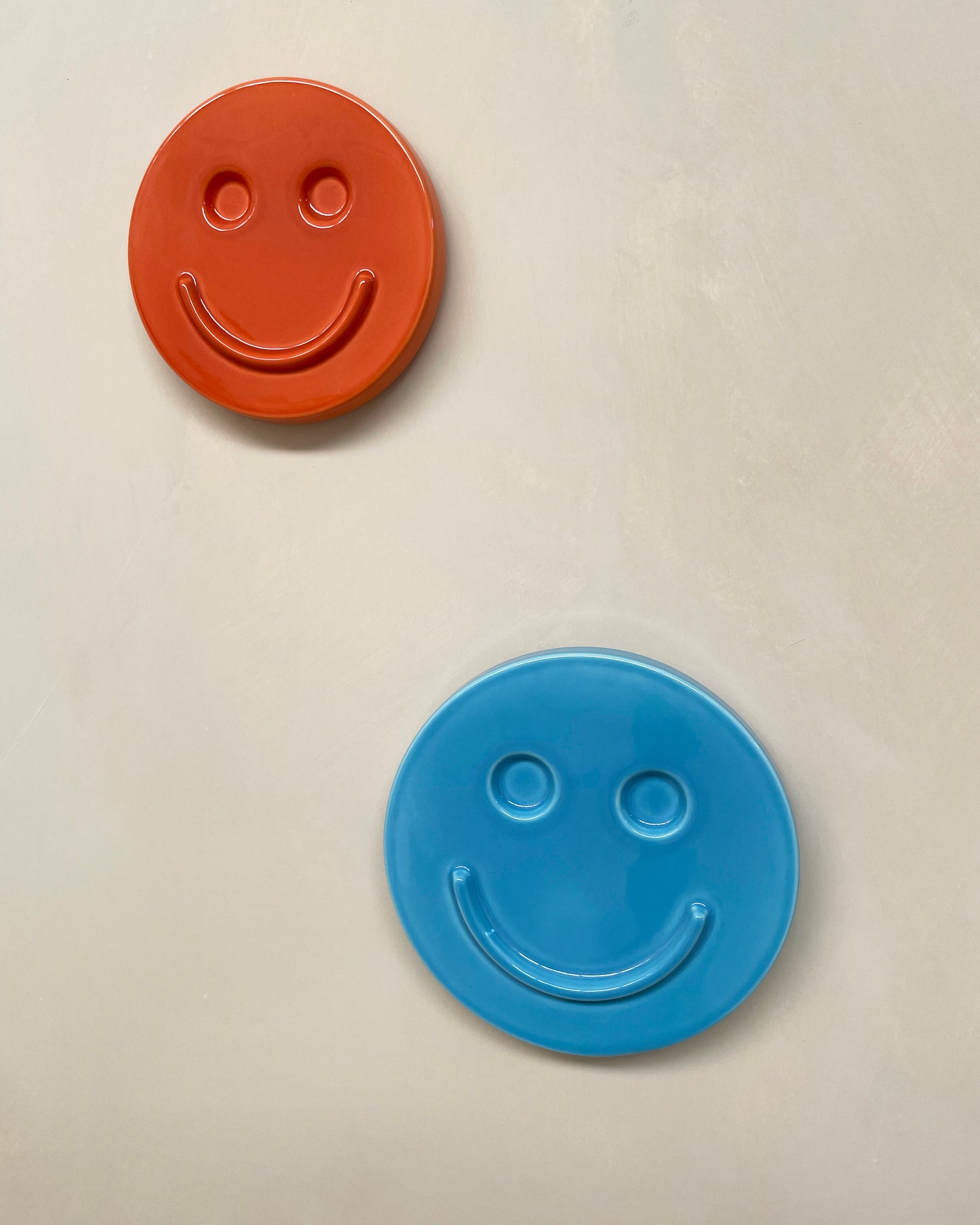 Orange 'HAPPY' ceramic artwork