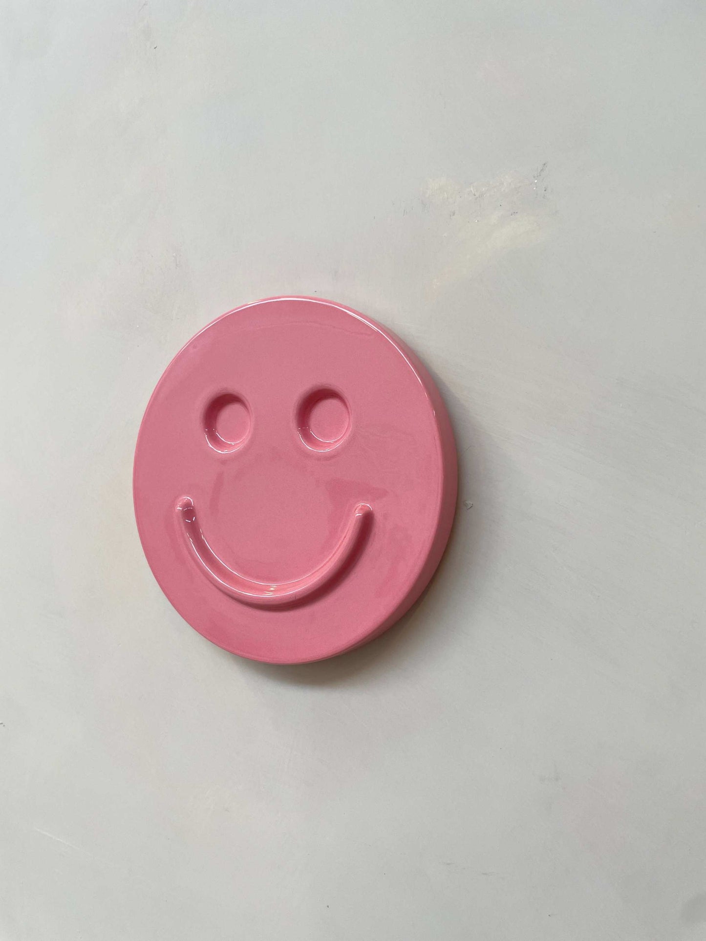 Pink 'HAPPY' ceramic artwork