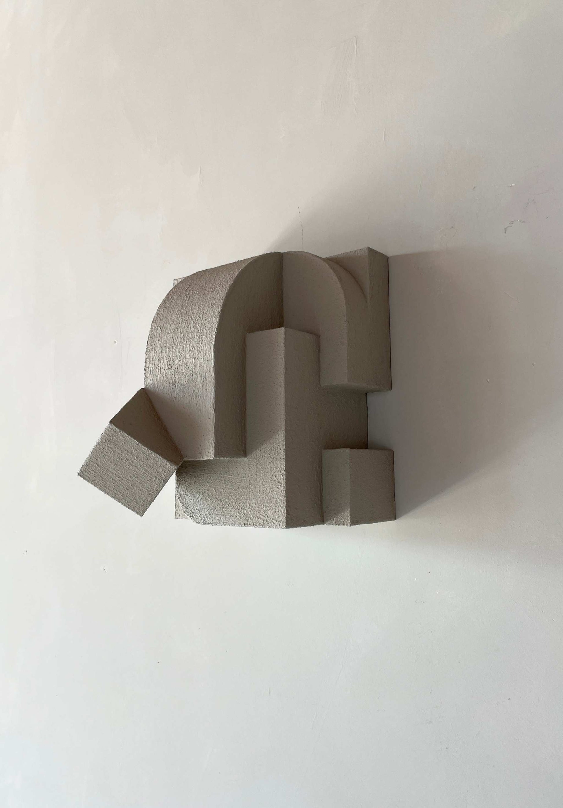 Organic wall sculpture 'Erica' in sand finish with architectural design, 25x21.2x21.2 cm.