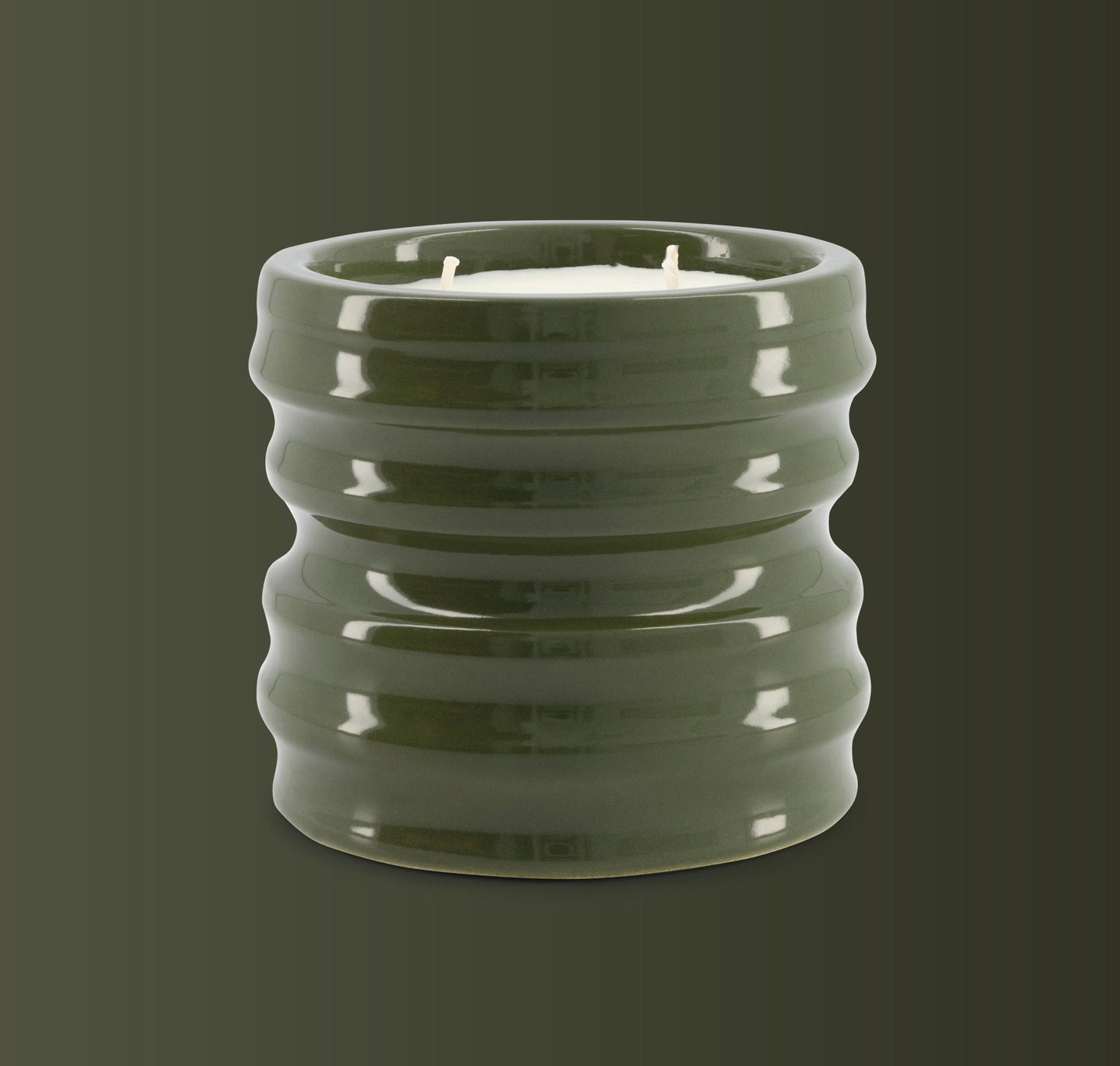 Scented candle in green ceramic holder, Shape 04 design, from the Shapes Collection.