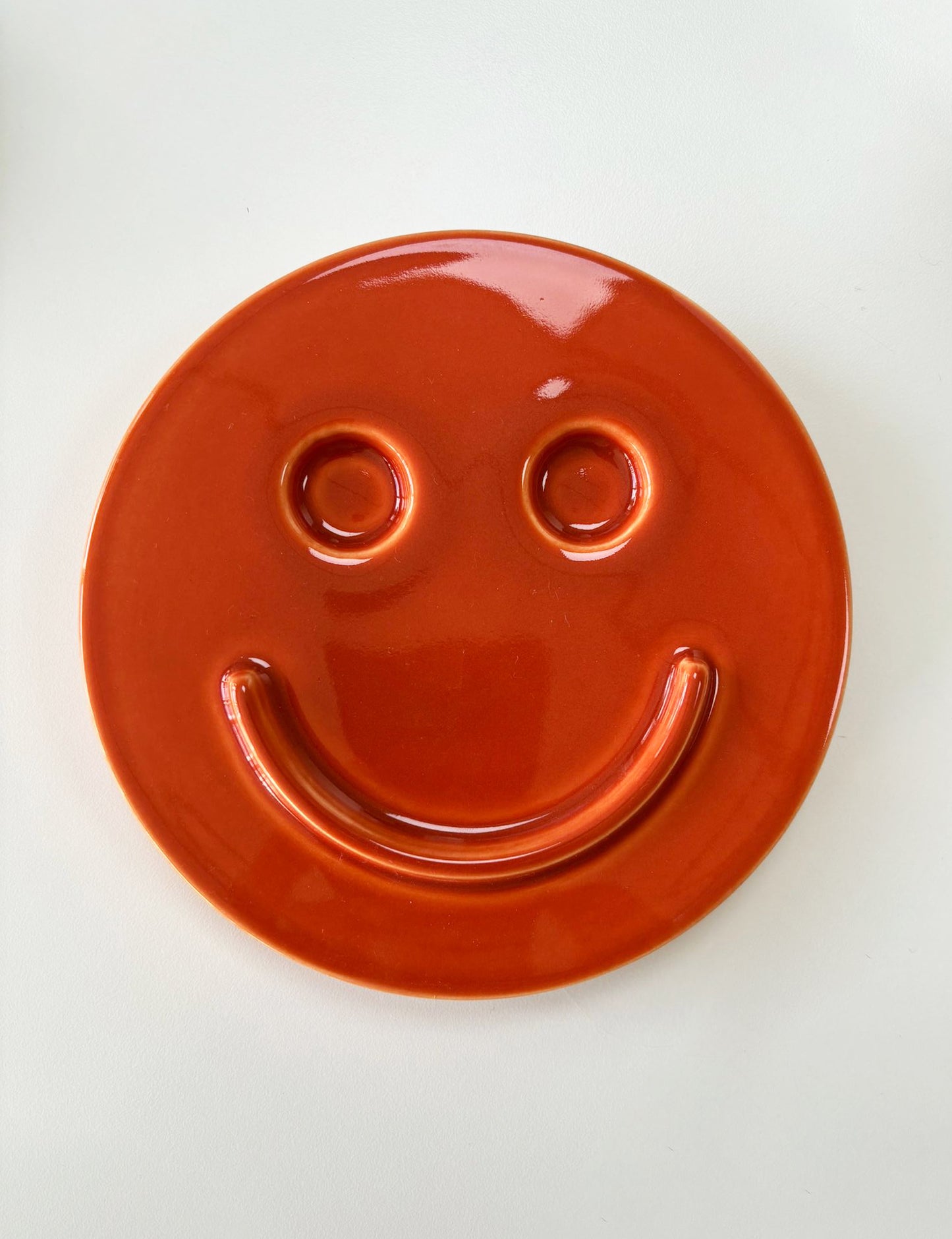 Orange 'HAPPY' ceramic artwork