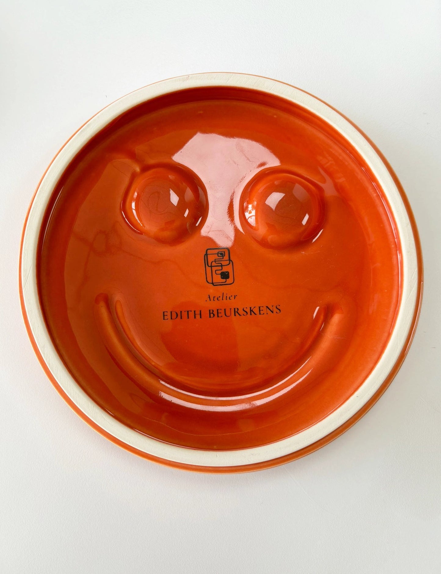 Orange 'HAPPY' ceramic artwork