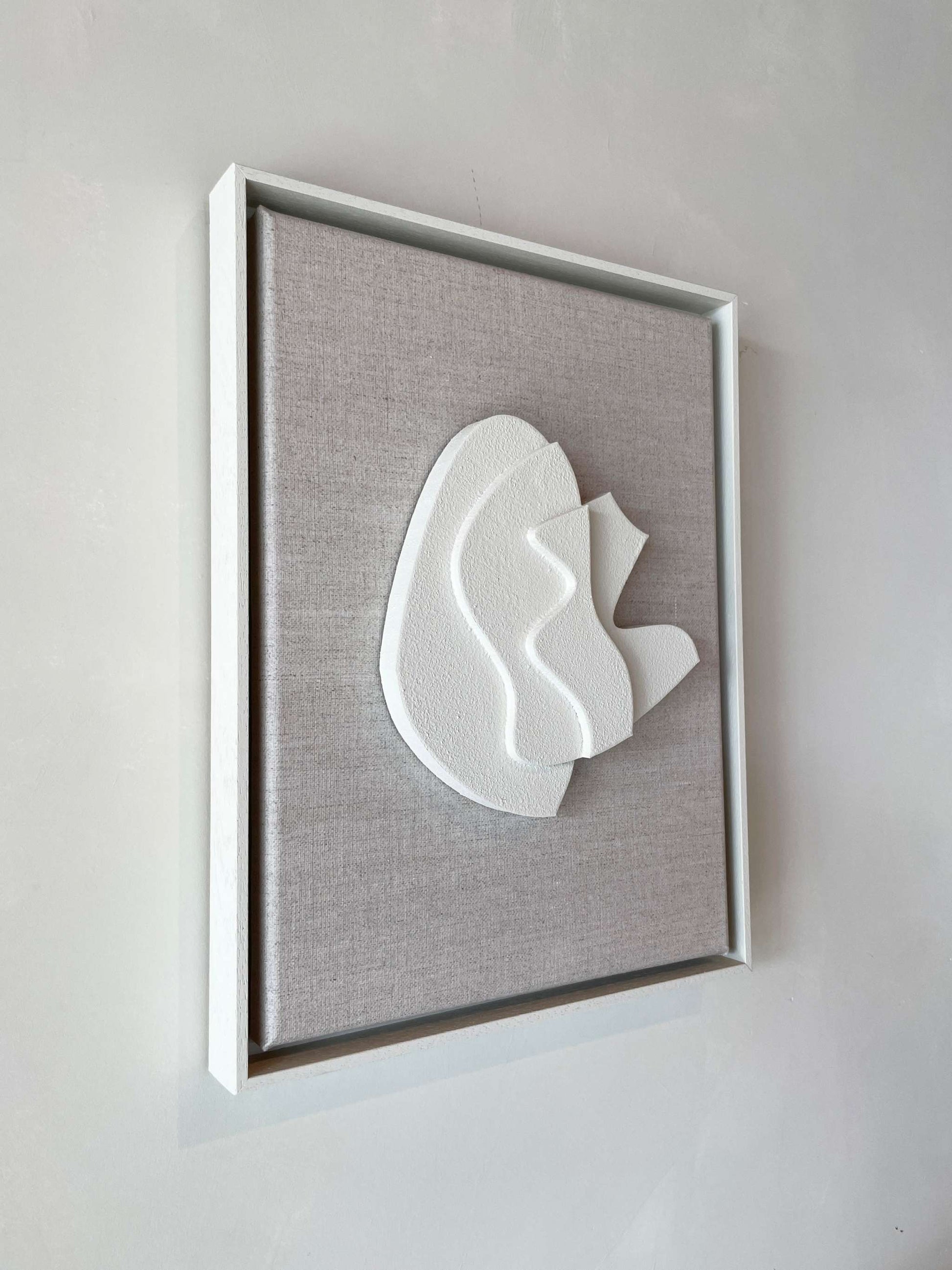 Canvas Sol artwork with biodegradable PLA base, shadow white structured plaster, shadow white frame, 43x33.5 cm.