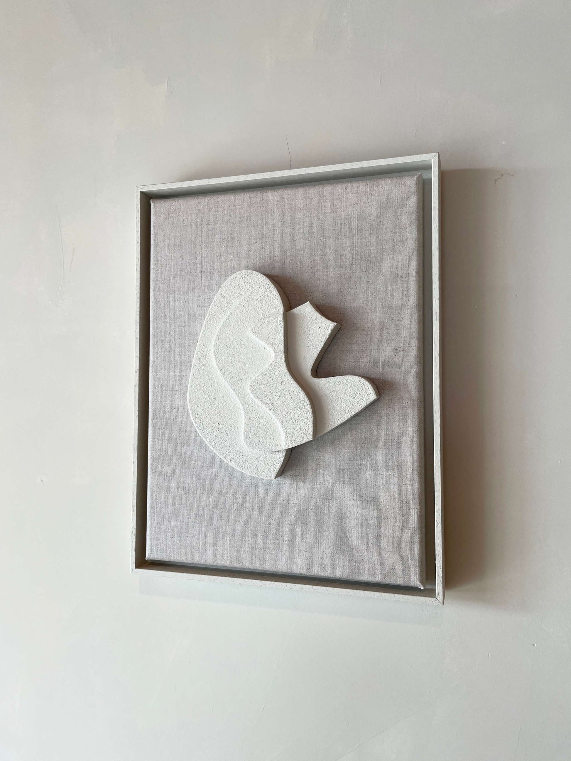 Canvas Sol artwork with a plant-based PLA frame in Shadow White, featuring a structured plaster surface, size 43 x 33.5 cm.